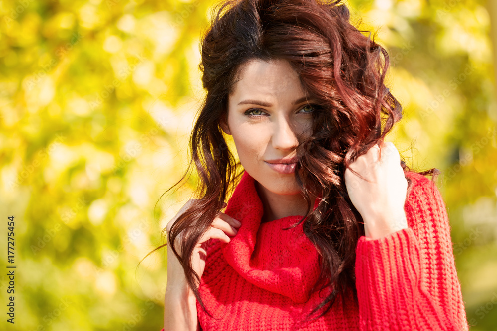 Autumn woman in autumn park. Warm sunny weather. Fall concept Autumn woman in autumn park. Warm sunny weather. Fall concept