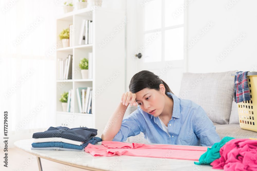 beauty housewife folding clothing in living room beauty housewife folding clothing in living room