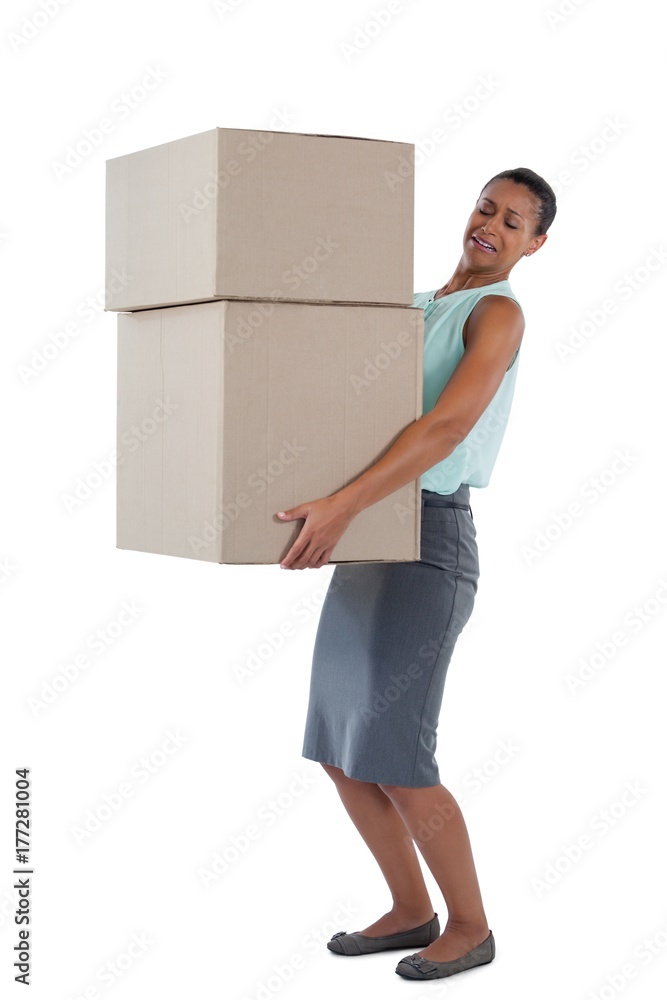 Businesswoman carrying heavy boxes Businesswoman carrying heavy boxes