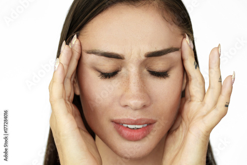 Wallpaper Mural Woman holds fingers on her temples showing headache Torontodigital.ca