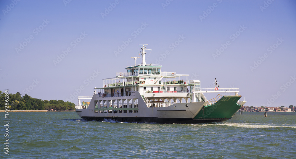 The ship sails along the Grand Canal in Venice, Italy.