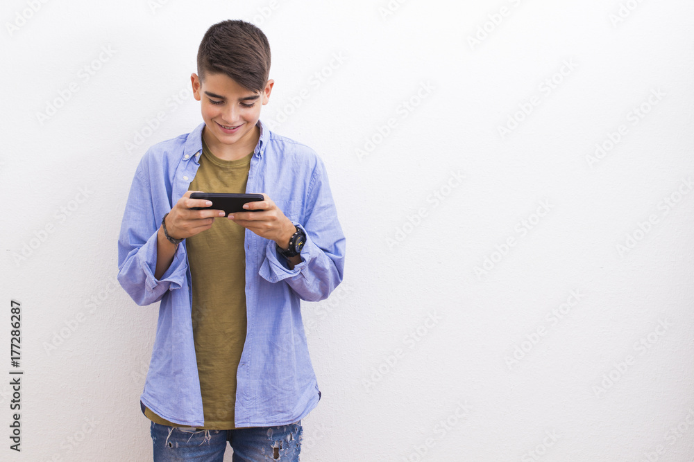young teenager with blank cell phone isolated young teenager with blank cell phone isolated