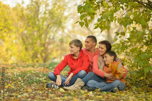 family in autumn forest