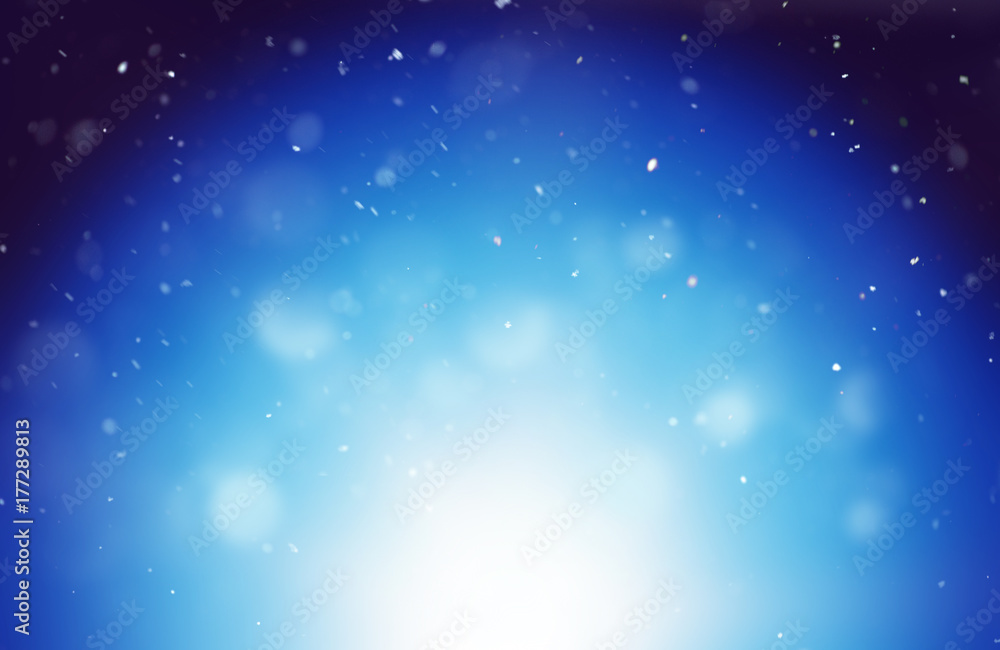 Winter background with blurred snowflakes at night