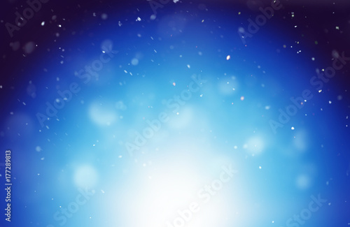 Winter background with blurred snowflakes at night