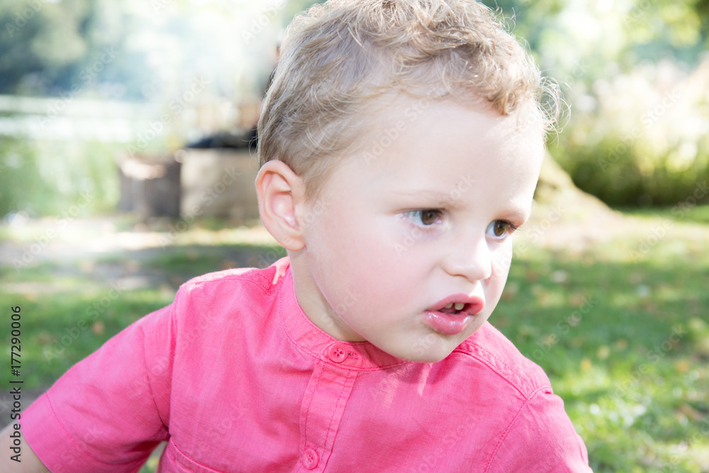 Portrait young hispanic or latino boy outdoor in park, with sad serious thoughtful facial expression, Portrait young hispanic or latino boy outdoor in park, with sad serious thoughtful facial expression,