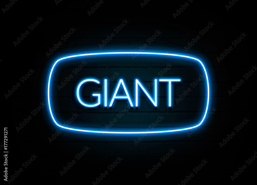 Giant - colorful Neon Sign on brickwall Giant - colorful Neon Sign on brickwall