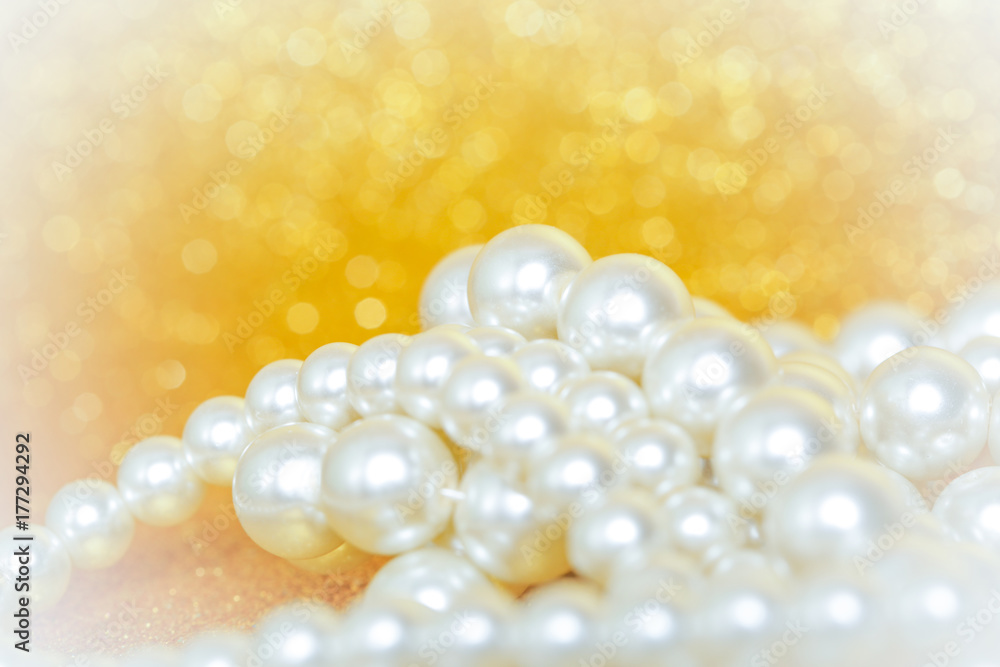 Pile of pearls on golden christmas background Pile of pearls on golden christmas background