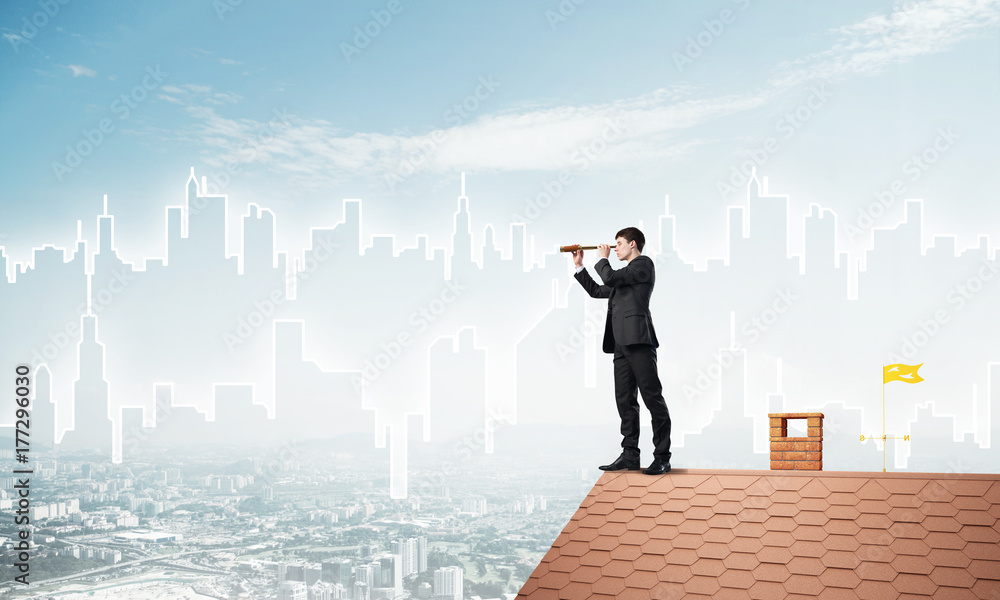 Engineer man standing on roof and looking in spyglass. Mixed media Engineer man standing on roof and looking in spyglass. Mixed media