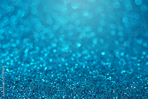 Blue bright glitter bokeh background. Sparkle texture for birthday card or christmas, new year, valentine's day, party and other holidays invitation.