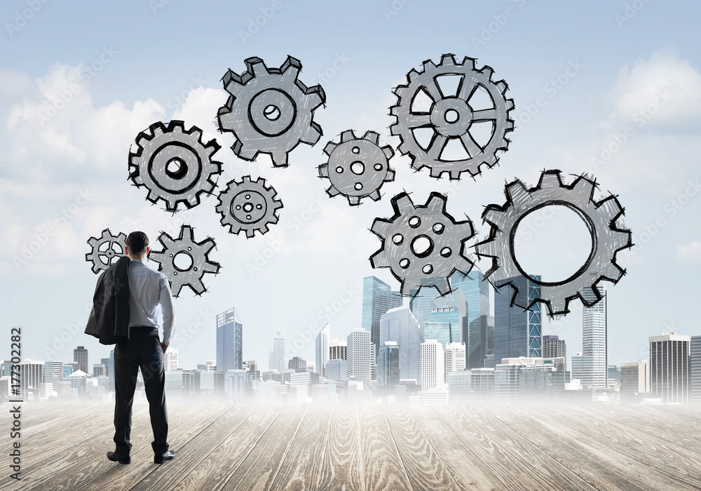 Cogwheel engine drawn on screen as symbol for teamwork and cooperation Cogwheel engine drawn on screen as symbol for teamwork and cooperation
