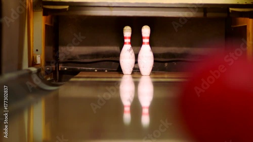 Bowling ball knocking pins on the bowling lane. Slow motion