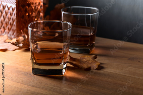 Fototapeta Naklejka Na Ścianę i Meble -  Whiskey on a old wooden table.