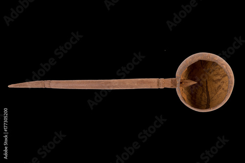 Ladle, dipper, scoop ,Old thai style retro coconutshell ladle isolated on white backgroud. photo