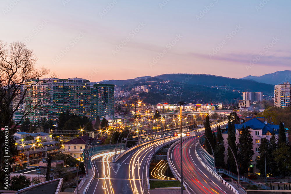 Beautiful aerial view of city, mountains and highway 