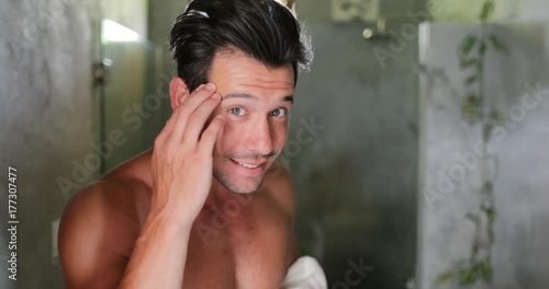 Man In Bathroom Looking In Mirror Fixing Hair, Handsome Young Guy In Morning Point Of View Slow Motion 60