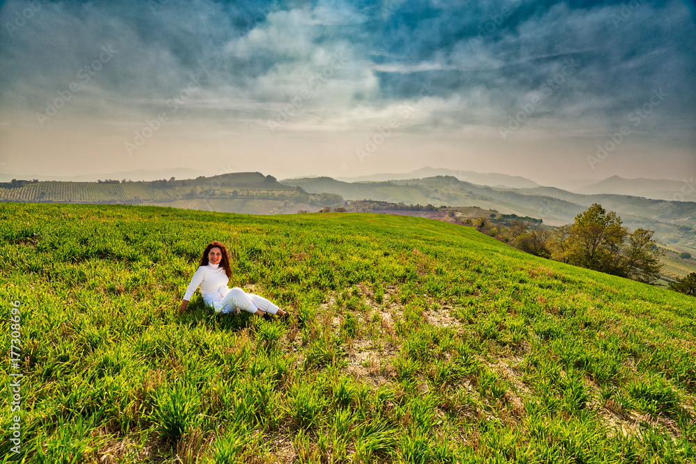 menopausal woman on green hill