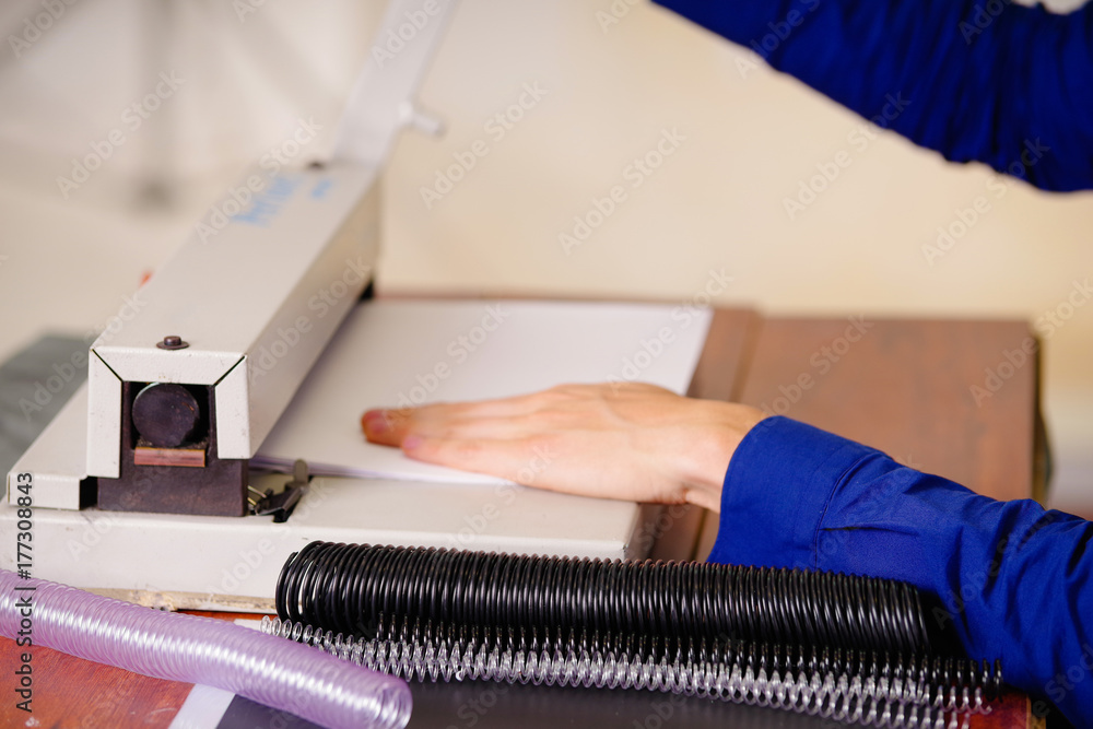 Man hands over a binder using for binding documents with plastic ring binder Man hands over a binder using for binding documents with plastic ring binder
