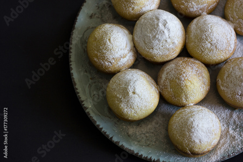 Tasty vanilla muffins on an ornamented plate
