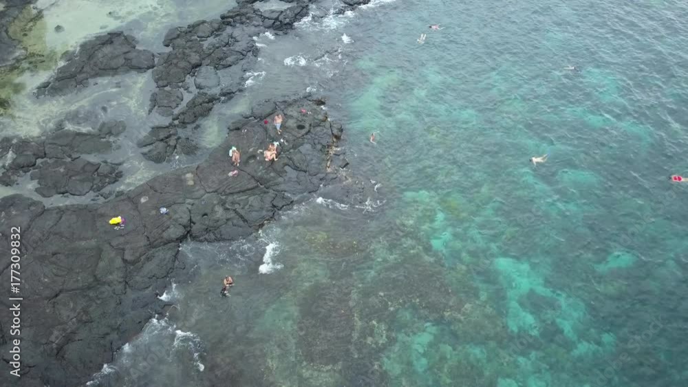 Aerial beautiful Two Step Beach swimming snorkel underwater beauty. Vacation destination. Big Island. Economy is tourism based. Water and tropical beach recreation and fun. Aerial beautiful Two Step Beach swimming snorkel underwater beauty. Vacation destination. Big Island. Economy is tourism based. Water and tropical beach recreation and fun.