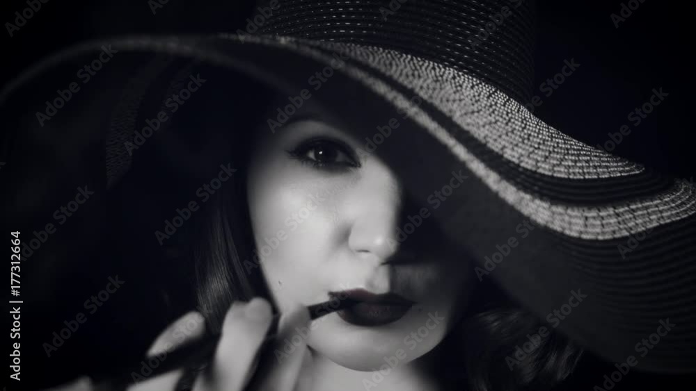 4k Woman Smoking with Cigarette Holder, black and white 4k Woman Smoking with Cigarette Holder, black and white