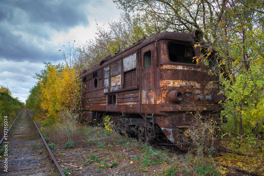 Hopeless post apocalyptic landscape. Cemetery of abandoned broken trains.