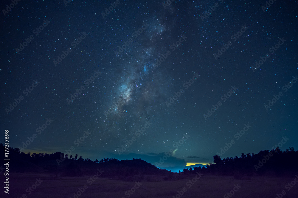 Long exposure and High ISO (800) shot of star and milky way over the silhouette mountain and rice field at night. Long exposure and High ISO (800) shot of star and milky way over the silhouette mountain and rice field at night.