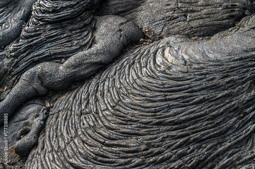 Pahoehoe or rope lava, on Rabida Island, Galapagos. It is formed of igneous rock, which create bizarre patterns as it cools known as lava sculpture.