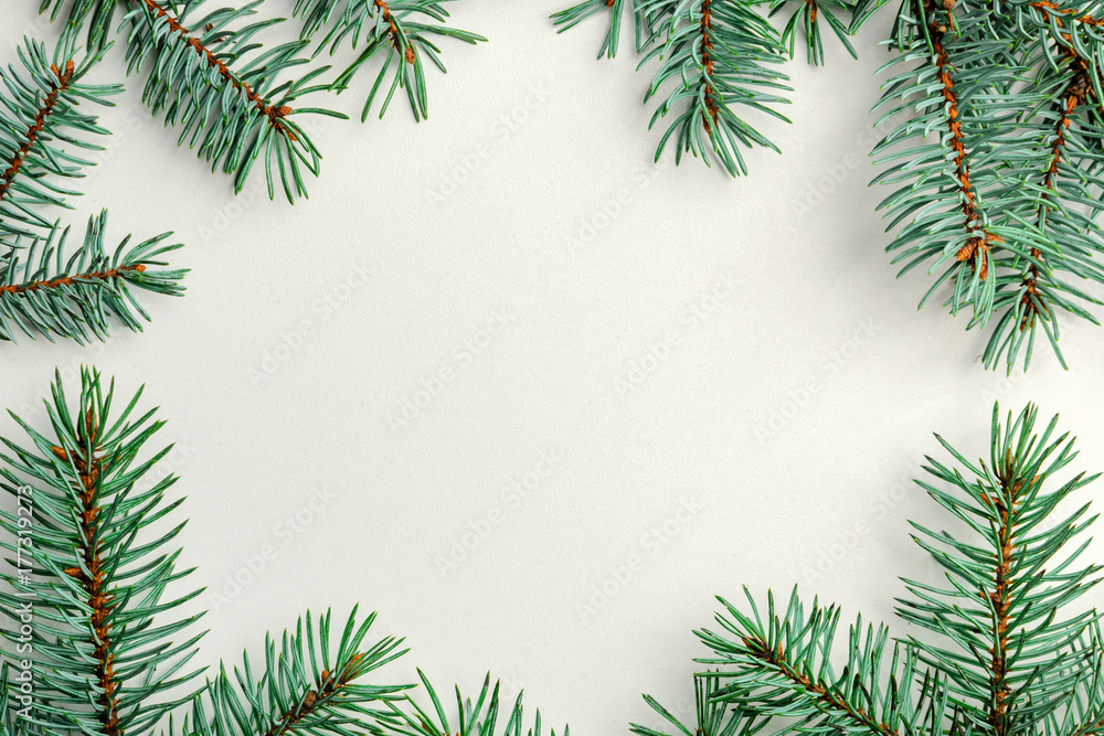 New Year frame made from fir branches on a white background. New Year frame made from fir branches on a white background.