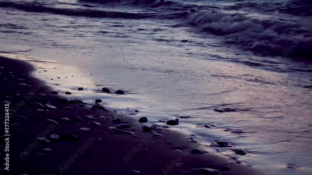 Waves crashing on beach during sunset Waves crashing on beach during sunset