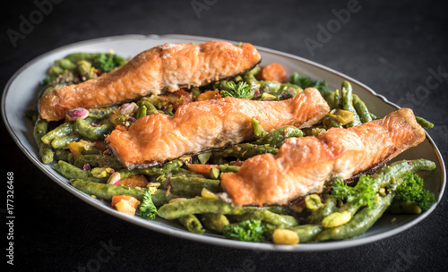 Salmon and spinach spaghetti served in the plate,selective focus