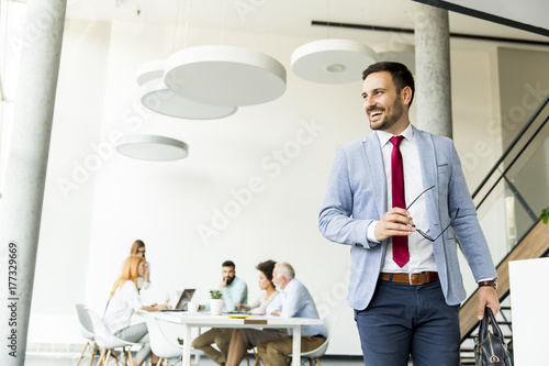 Young businessman leaves a ...