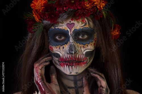 Beautiful girl with scary Halloween make-up