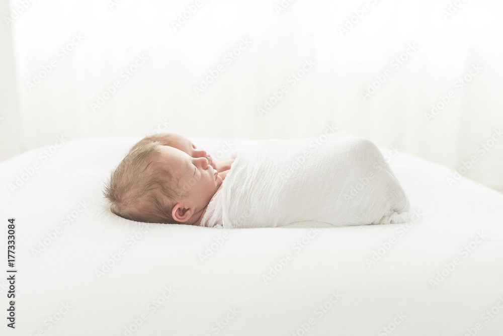 Twin Girl And Boy Backlit And Swaddled Together Twin Girl And Boy Backlit And Swaddled Together