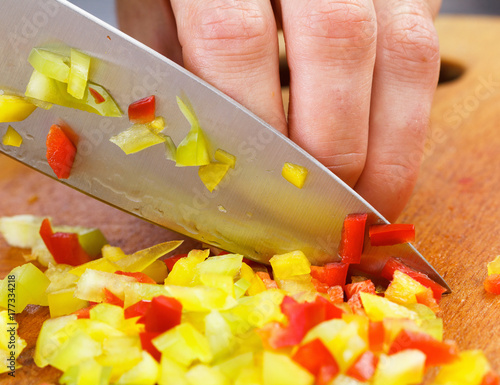 Chef cutting bell pepper fo...