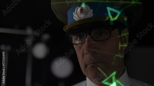 RUSSIAN OFFICER LOOKING AT A SONAR SCREEN.  Version 1 of 2.  Model release. photo