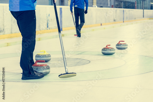 Playing a game of curling.