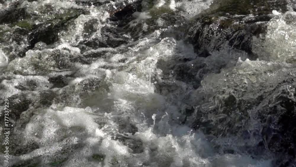 Creek water foaming up in slow motion Creek water foaming up in slow motion