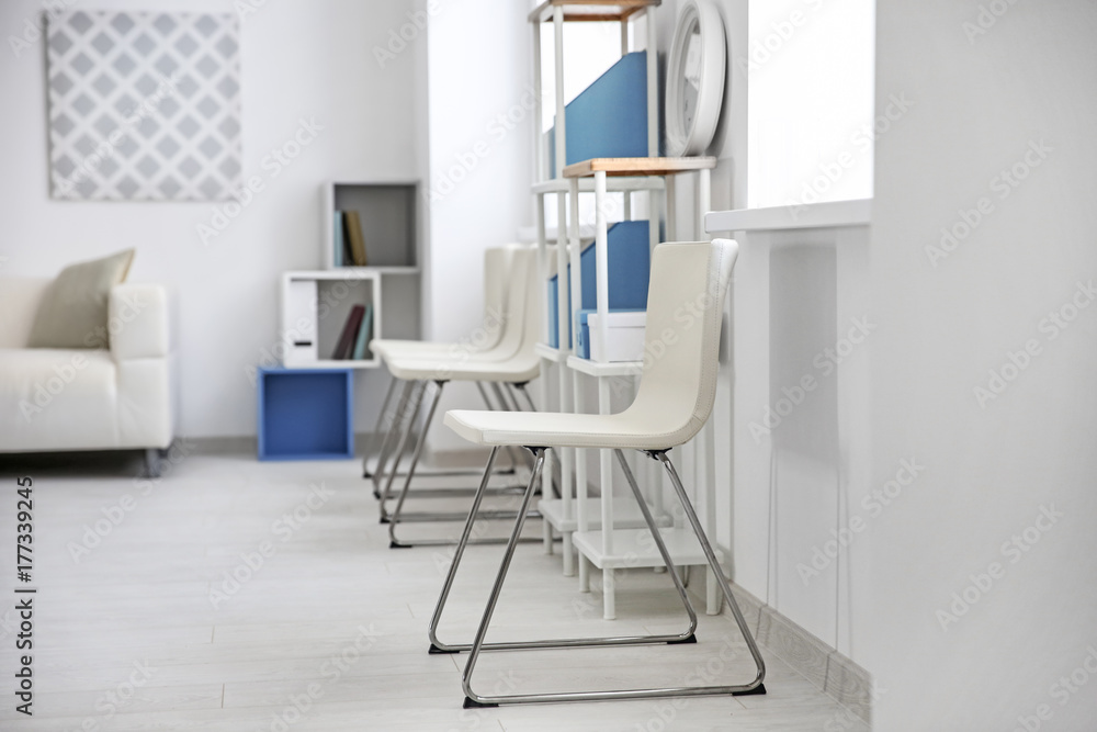 Fototapeta premium Modern room interior with white chairs and shelving unit