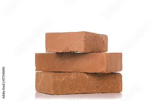 Solid clay bricks used for construction,Old red brick isolated on white background. Object isolated