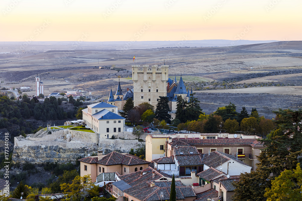 Aerial view of Segovia Alcazar at sunset with the detail of the high of the hill. Castilla y Leon, city in Castile and Leon. Declared World Heritage Site
