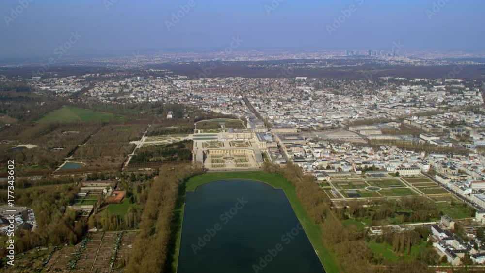 Aerial view above the palace of Versailles with landscaped gardens Aerial view above the palace of Versailles with landscaped gardens