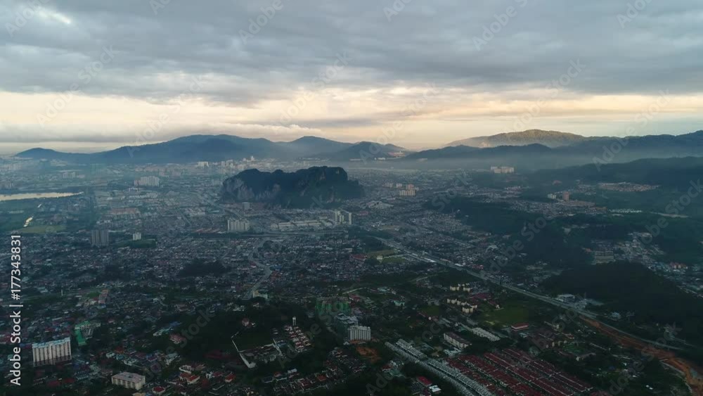 Aerial view. Building and houses were built around hills. Aerial view. Building and houses were built around hills.