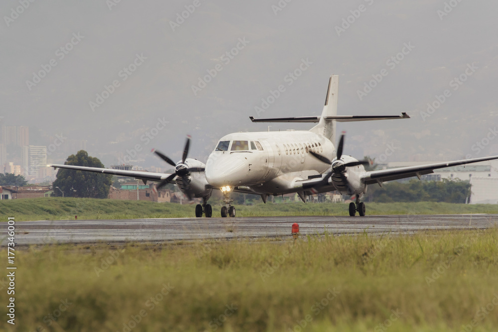 Medium sized propeller passenger plane that has just landed Medium sized propeller passenger plane that has just landed
