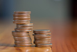Stacks of coins on working table, finance and business concept, shallow focus.