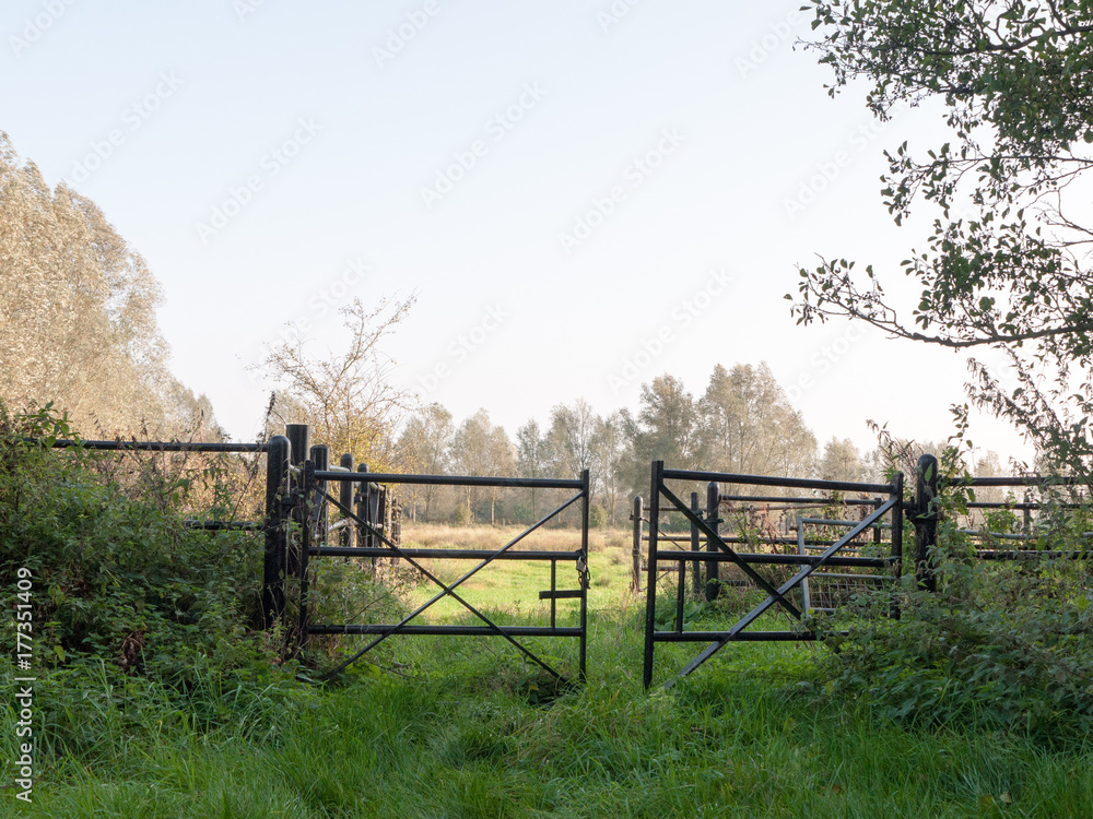 set of black farm field country gates empty and open