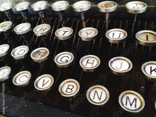 Vintage antique typewriter machine keys and letters photo