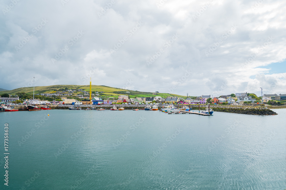 Instagram effect fishing boats and surrounding hills Dingle Harbour, Ireland.