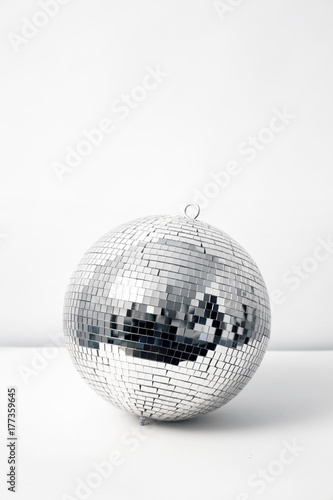 shiny silver disco ball on white background