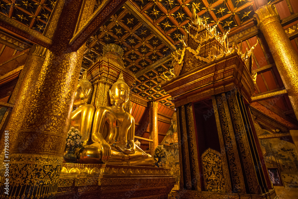 Golden buddha statue at Wat Phumin Temple, Nan province, Thailand. 400 years olds beautiful ancient temple. Famous tourist destination.